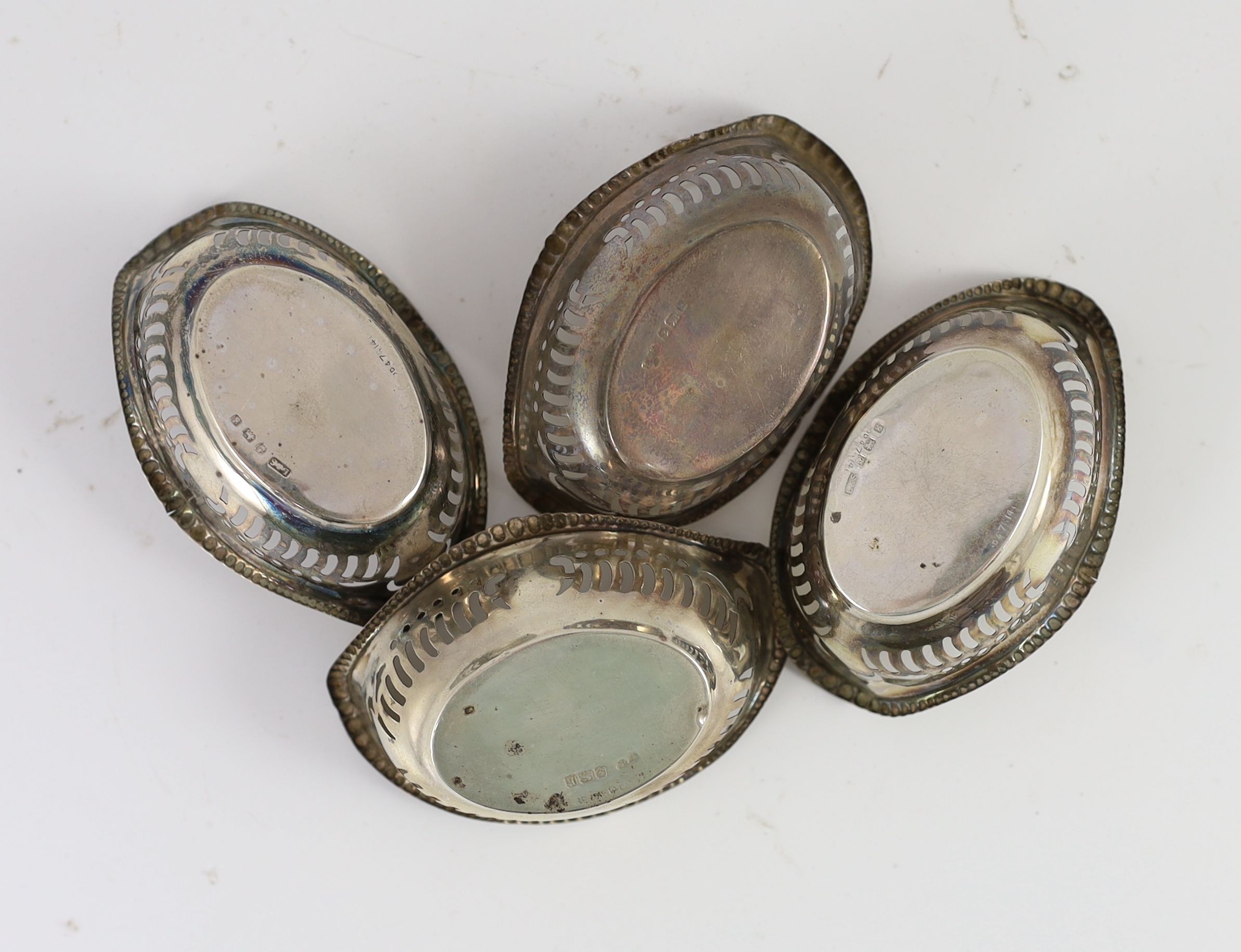 A set of four Edward VII silver pierced oval bon-bon dishes, 8cm wide 1.96oz.